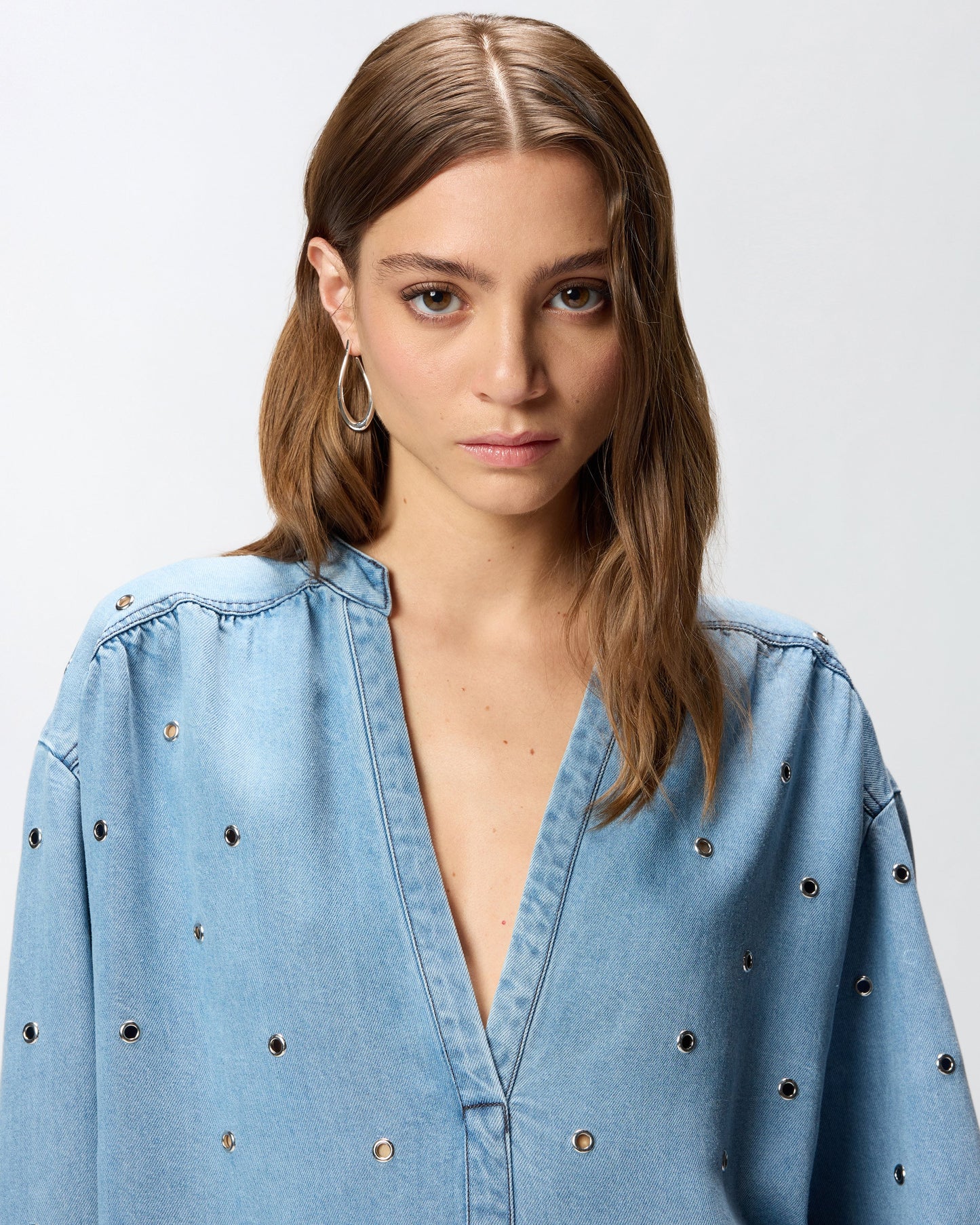 Denim blouse with eyelets