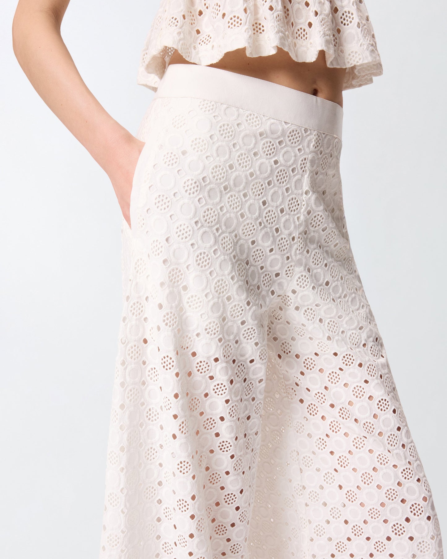 Trousers with openwork motif
