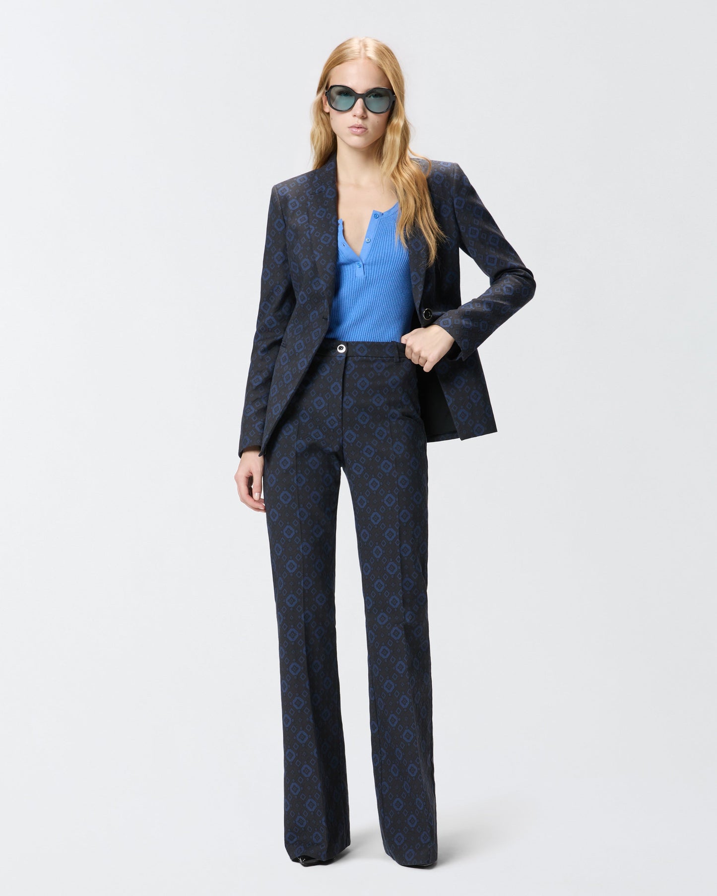 Trousers with a geometric and floral motif